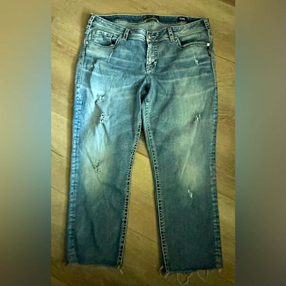 Vintage Silver Jeans- well worn, holes and hugs your body like a glove!